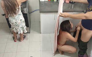 Cuckold MILF didn't notice her husband fucking her stepdaughter because she was too busy cooking