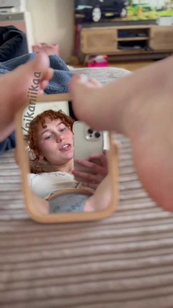 It looks like a mirror, but it’s actually a portal to redhead heaven