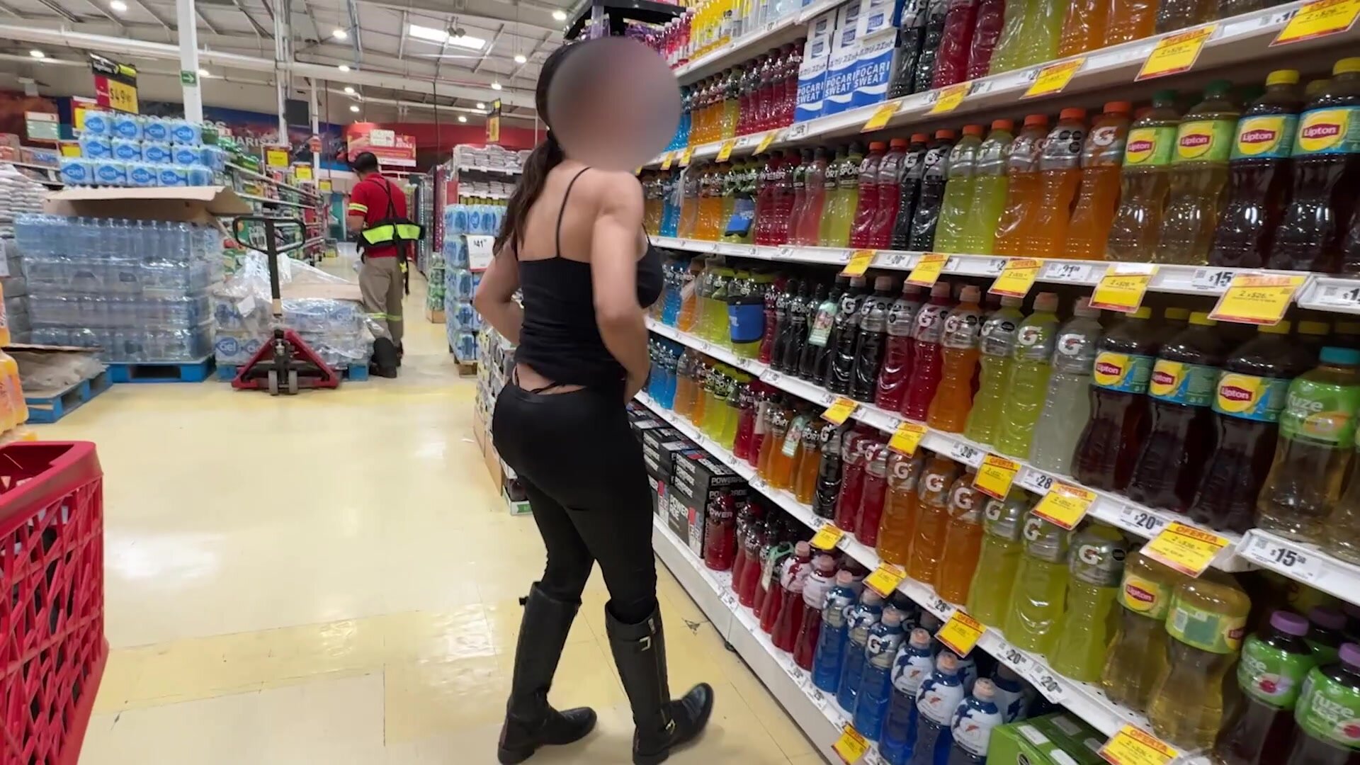 having fun at supermarket while the employee is distracted in his cellphone