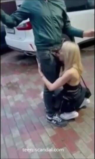 Sucking cock in front of a nightclub