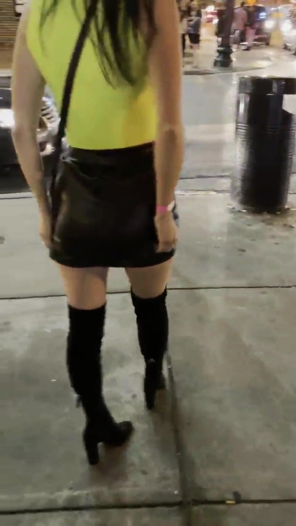 Lighted anal plug under her mini skirt in public
